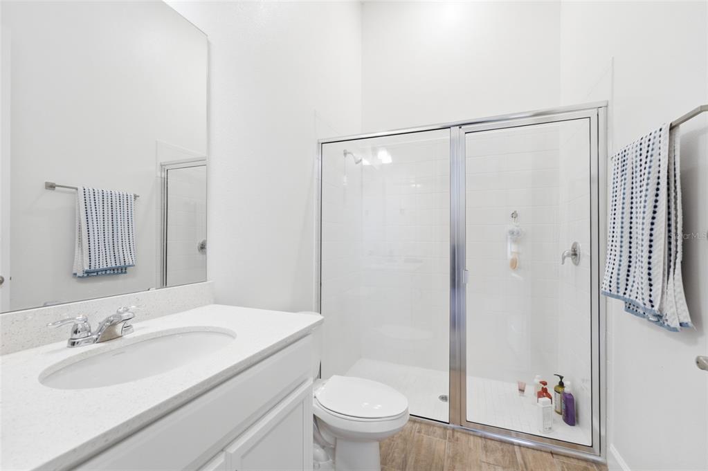 16071 Barkly Rdg Court Winter Garden, FL 34787 - Photo 27 of 31 a bathroom with a sink a toilet and shower