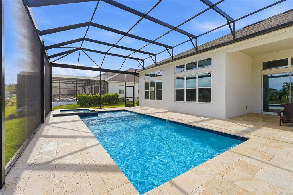 16071 Barkly Rdg Court Winter Garden, FL 34787 - Photo 29 of 31 a view of a patio with a table and chairs under an umbrella