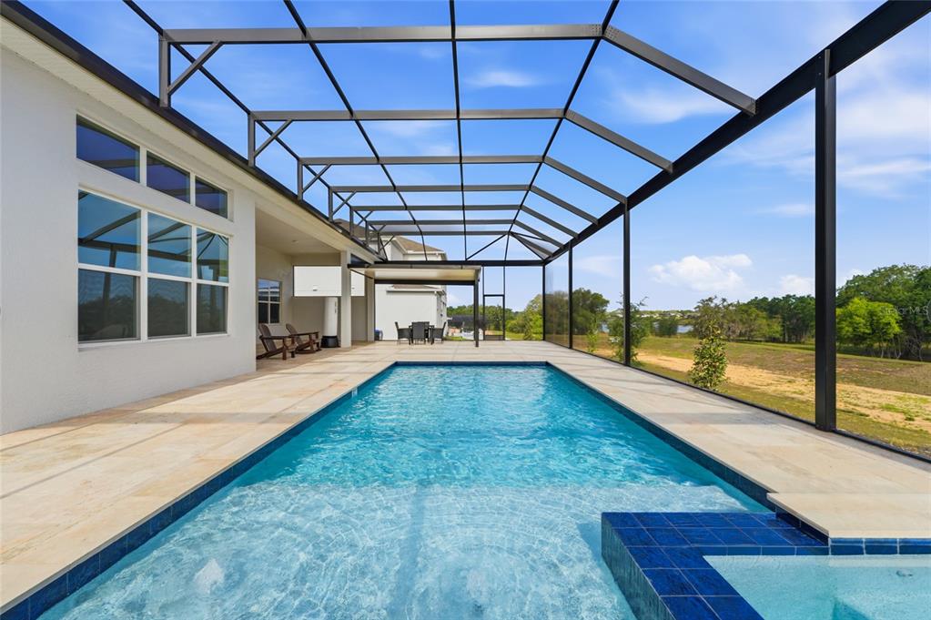 16071 Barkly Rdg Court Winter Garden, FL 34787 - Photo 7 of 31 a view of a swimming pool with a porch