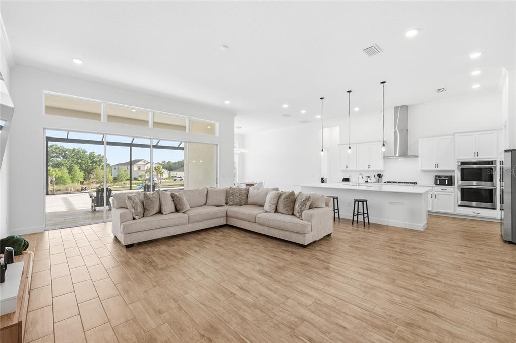 16071 Barkly Rdg Court Winter Garden, FL 34787 - Photo 8 of 31 a living room with furniture and a large window