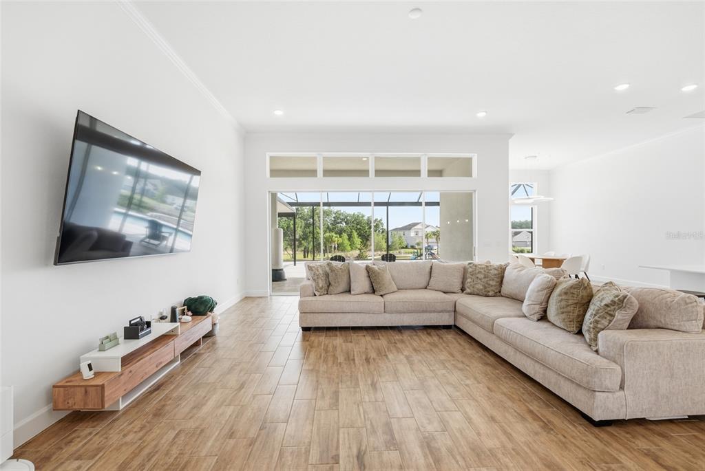 16071 Barkly Rdg Court Winter Garden, FL 34787 - Photo 9 of 31 a living room with furniture and a flat screen tv