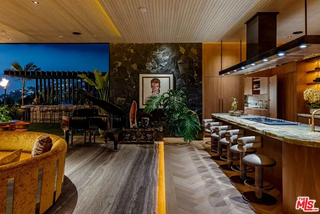 a view of a dinning room with furniture and wooden floor