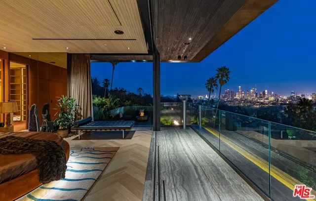 a room with lots of wooden furniture and a potted plant
