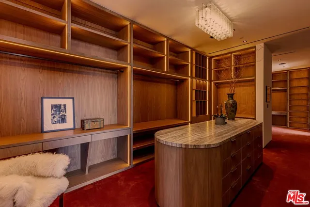 a bed room with a bed and a television