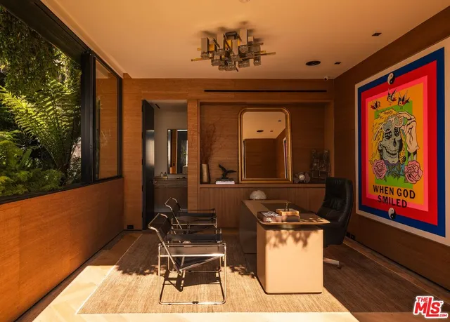a view of a chairs and table in patio