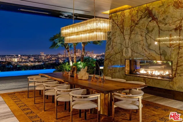 a view of a chairs and table in the patio