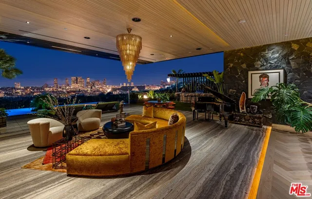 a front view of a house with sitting area