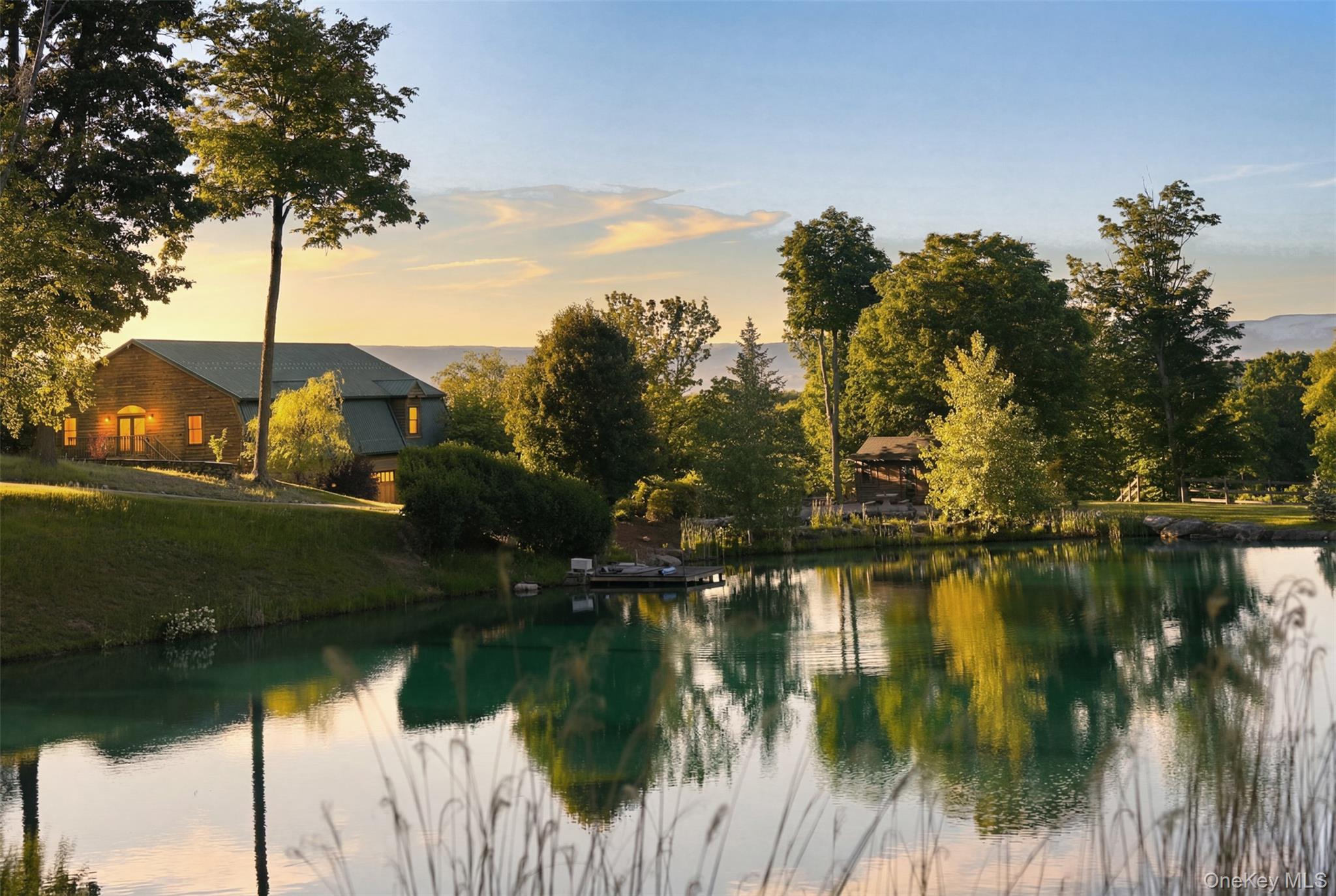 95 Judson Road Montgomery, NY 12549 - Photo 47 of 50 Completing this extraordinary offering is a stunning 1+ acre pond featuring docks, a waterfall, and waterside grilling patio—an idyllic backdrop for fishing, entertaining, or simply enjoying the peace and beauty of the Hudson Valley countryside.