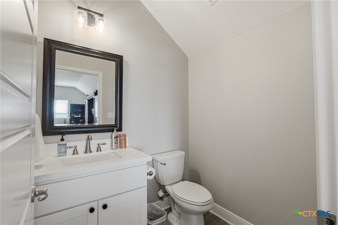 113 Terra Vista Ranch Road Victoria, TX 77904 - Photo 37 of 47 a bathroom with a toilet sink vanity and mirror