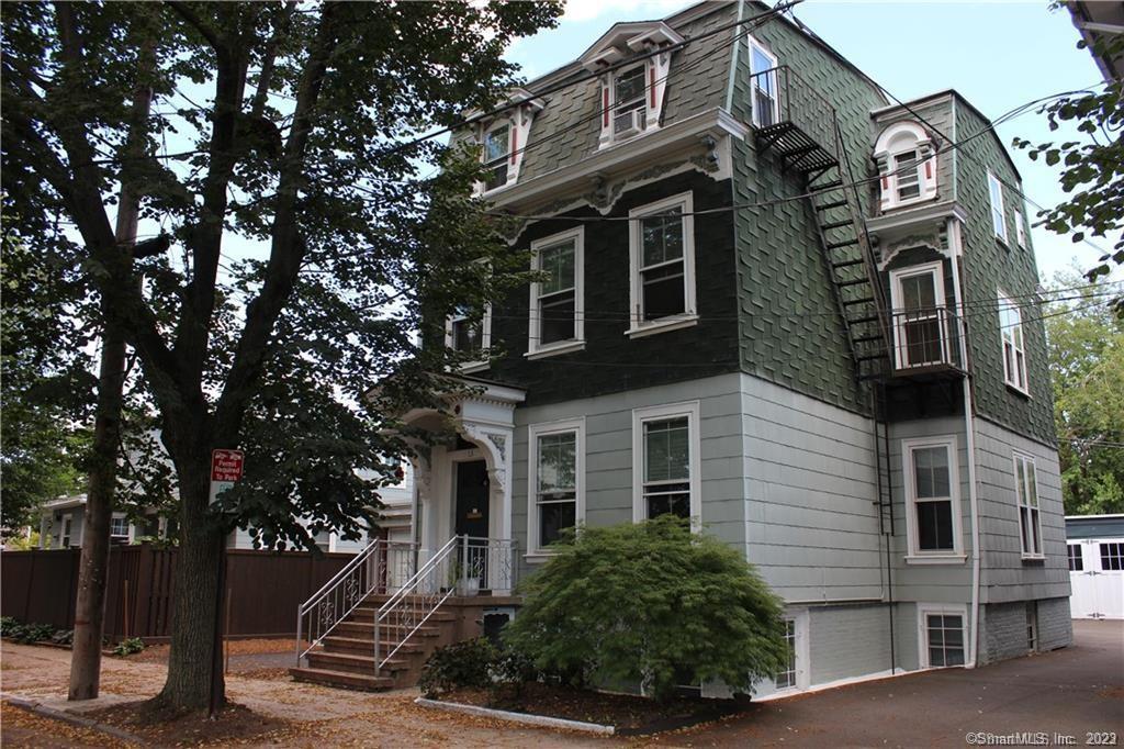 a view of a building with a tree