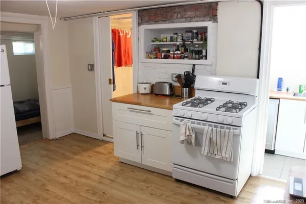 a kitchen with stainless steel appliances granite countertop a stove and a microwave