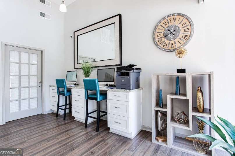 707 Franklin Road, Unit 1812 Marietta, GA 30067 - Photo 13 of 13 a view of a workspace with furniture and wooden floor