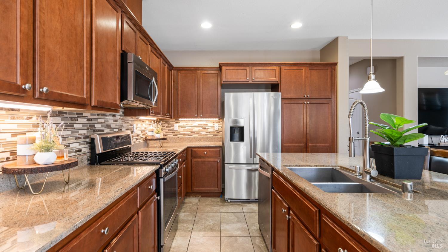 524 Chaparral Loop Vacaville, CA 95688 - Photo 13 of 43 a kitchen with stainless steel appliances granite countertop a refrigerator a sink and a stove