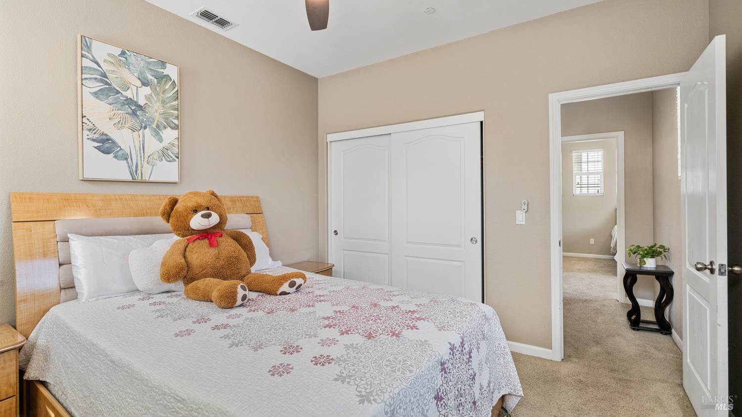 524 Chaparral Loop Vacaville, CA 95688 - Photo 21 of 43 a bedroom with a bed and wooden floor