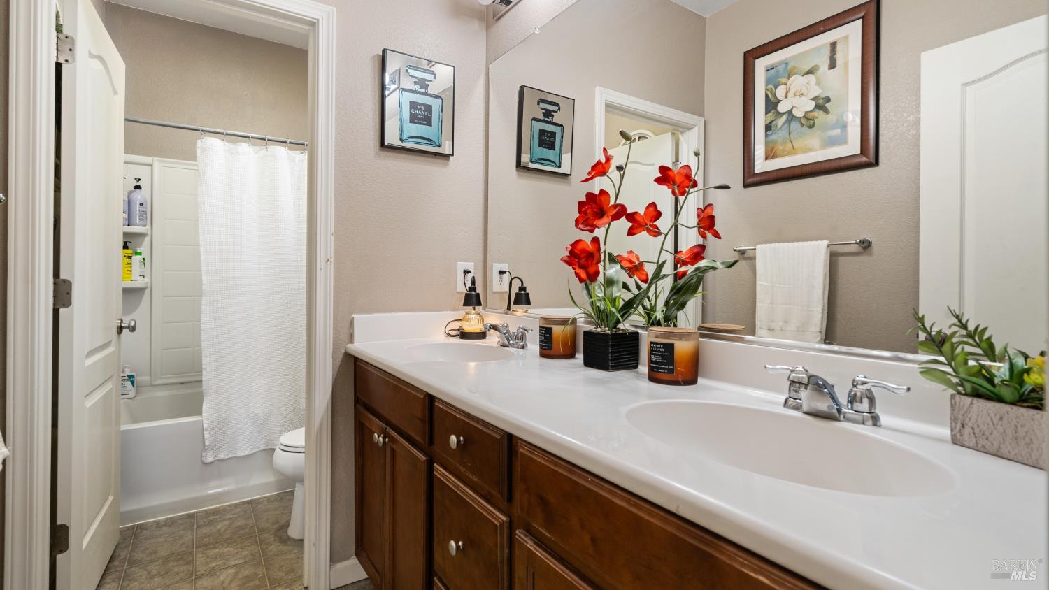 524 Chaparral Loop Vacaville, CA 95688 - Photo 22 of 43 a bathroom with a sink vanity and a mirror