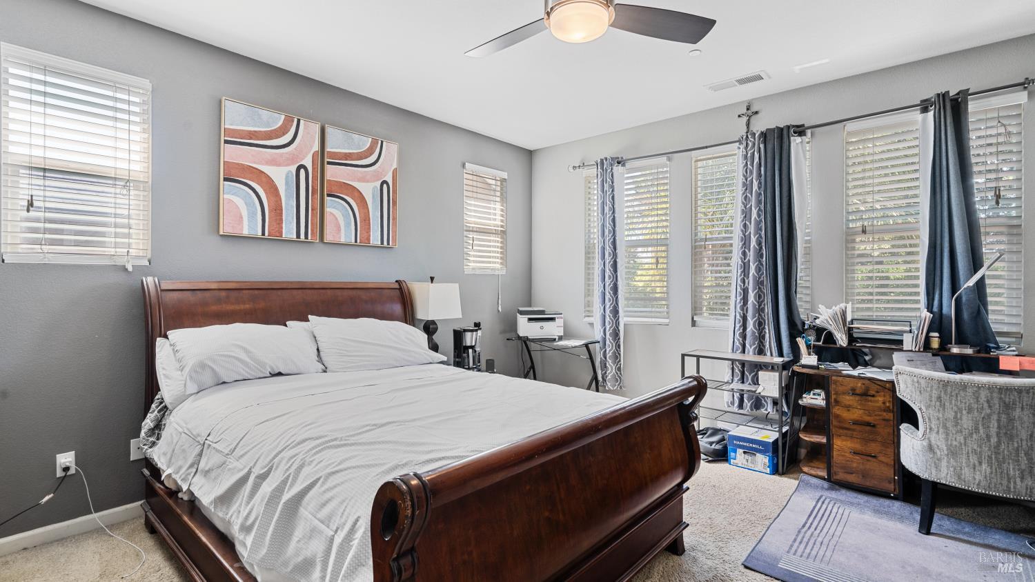 524 Chaparral Loop Vacaville, CA 95688 - Photo 24 of 43 a spacious bedroom with a bed and a chandelier