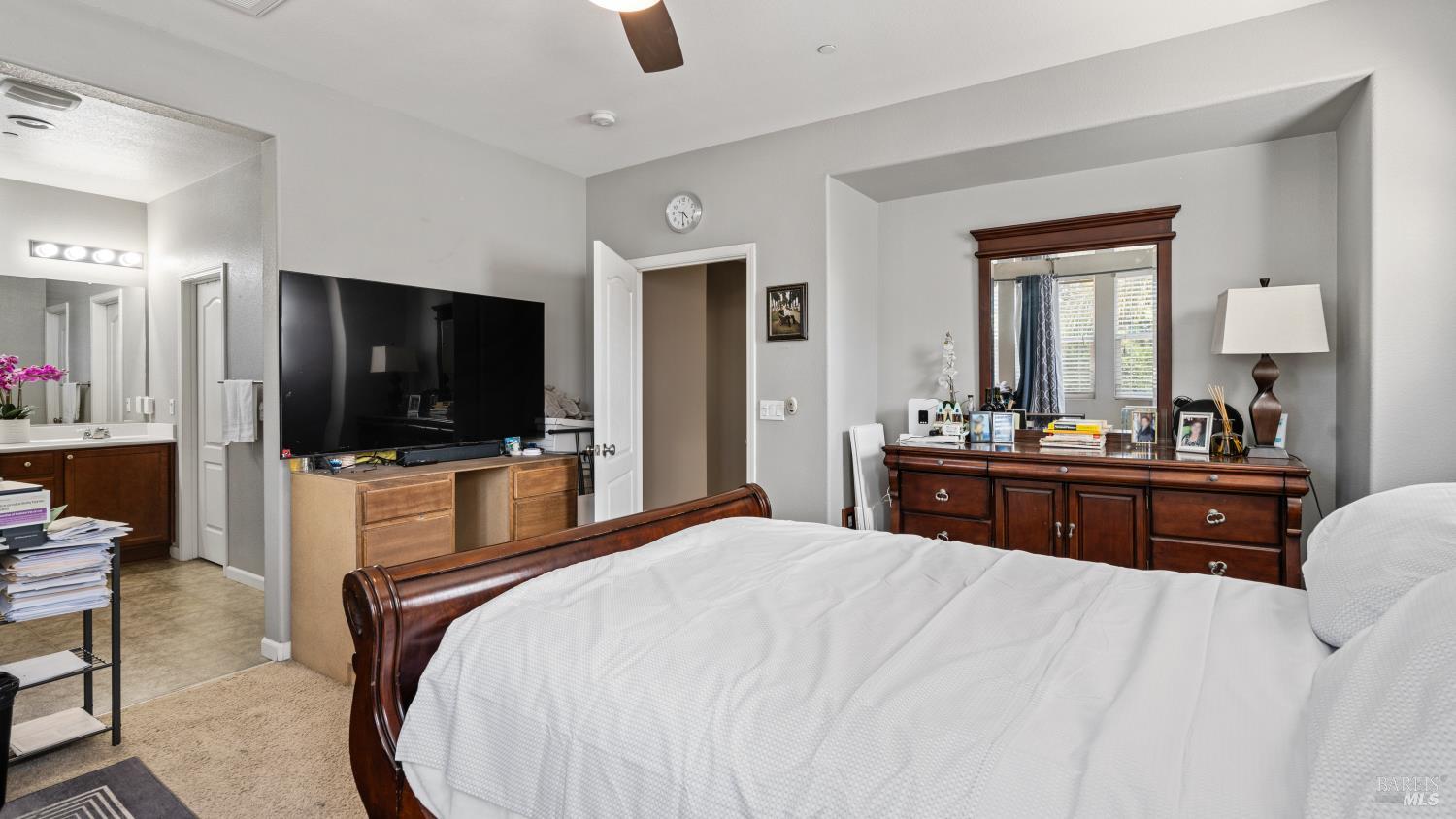 524 Chaparral Loop Vacaville, CA 95688 - Photo 25 of 43 a bedroom with a bed and a flat screen tv