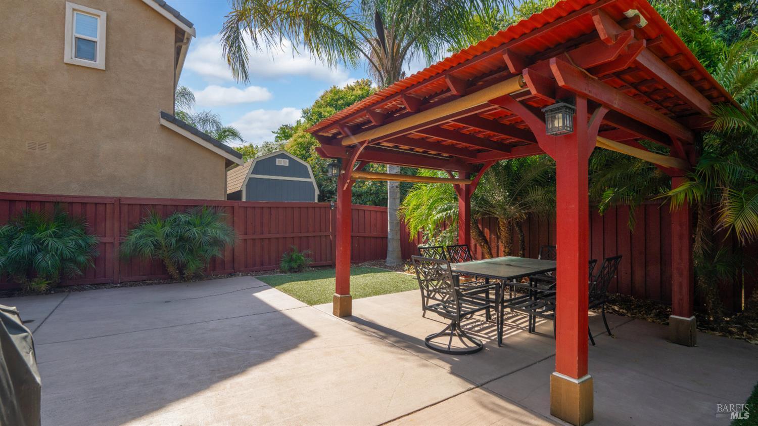 524 Chaparral Loop Vacaville, CA 95688 - Photo 29 of 43 a patio with a table and chairs and potted plants