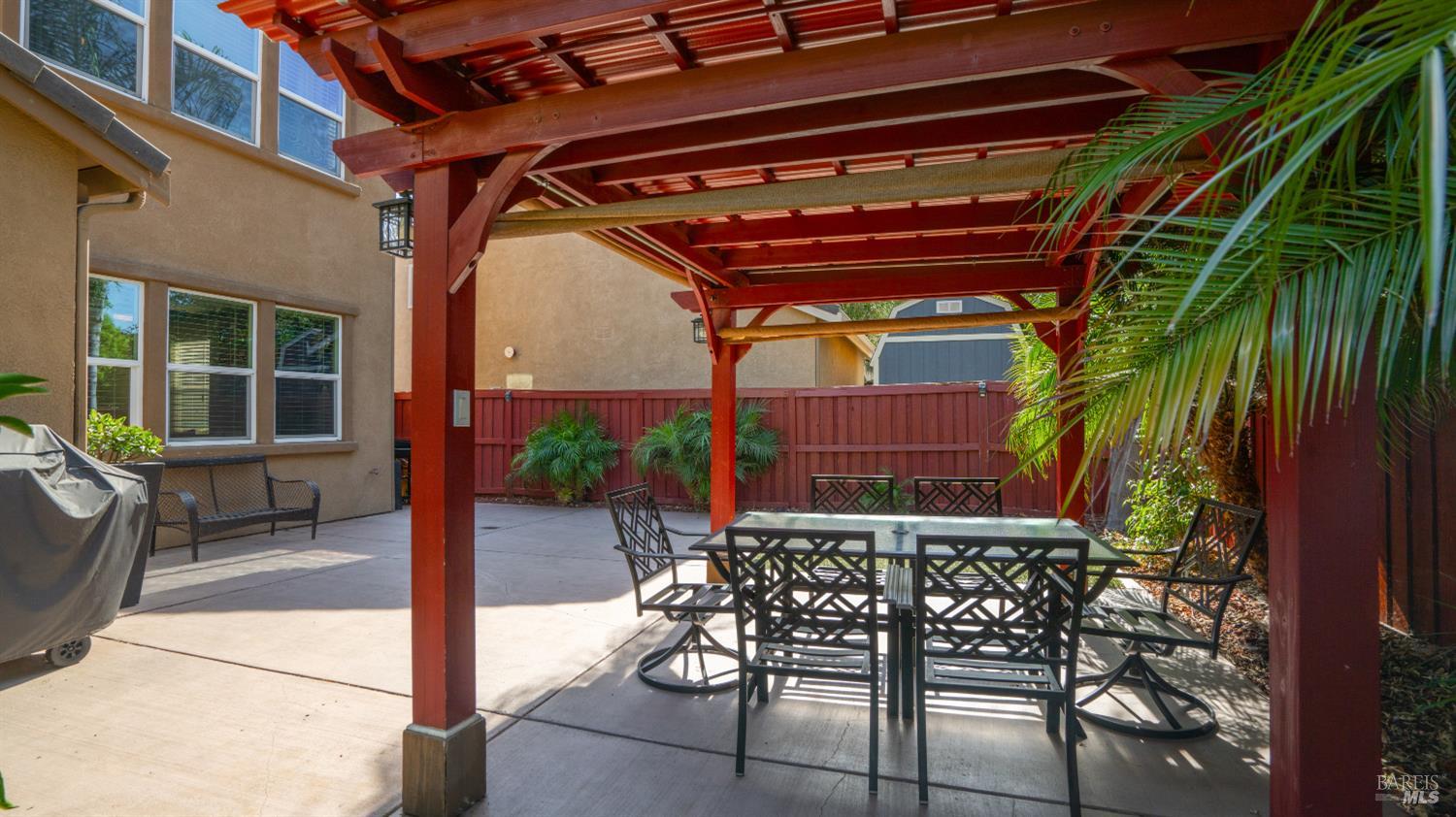 524 Chaparral Loop Vacaville, CA 95688 - Photo 30 of 43 a patio with glass top table and chairs