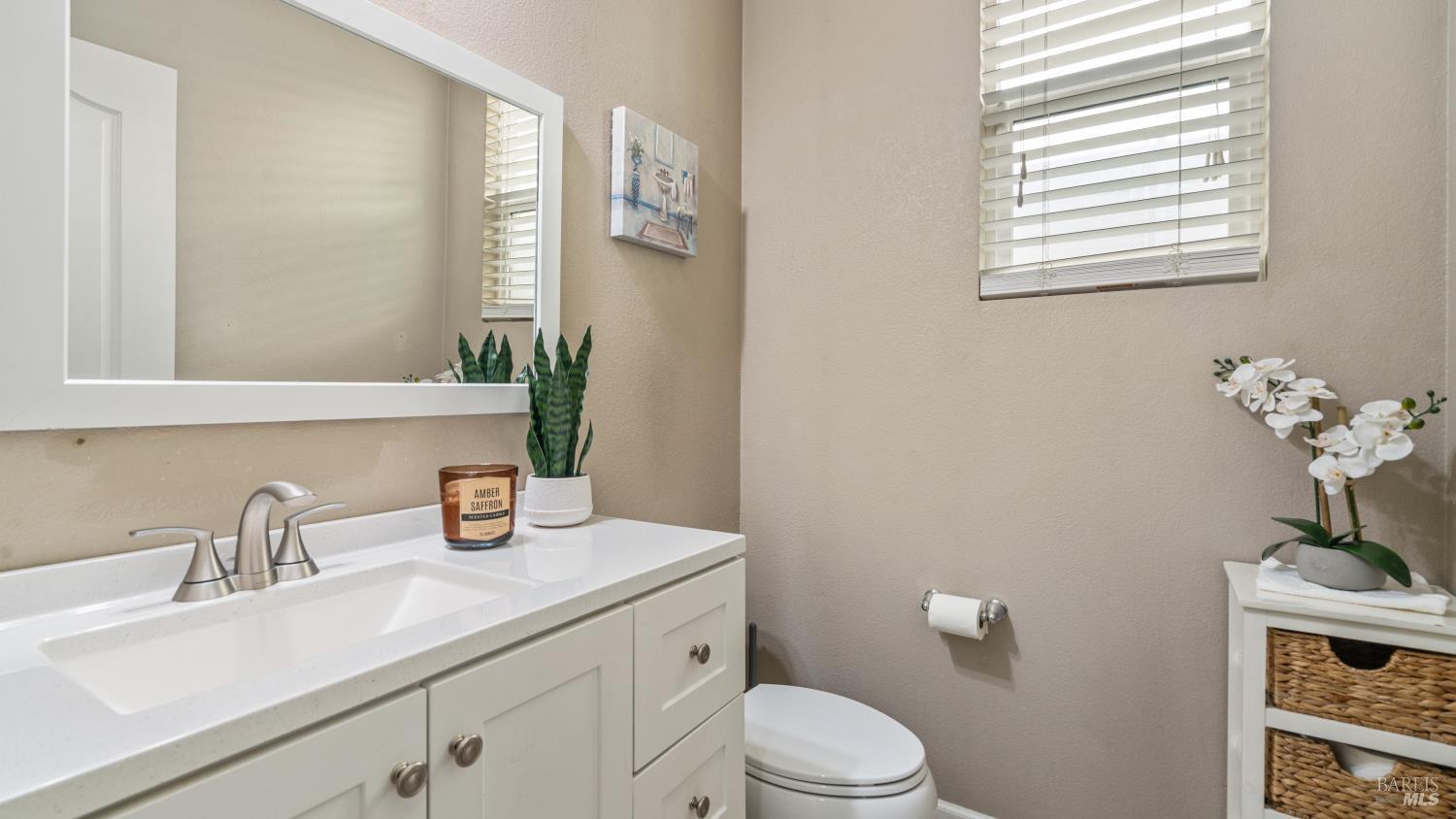 524 Chaparral Loop Vacaville, CA 95688 - Photo 7 of 43 a bathroom with a toilet a sink and mirror