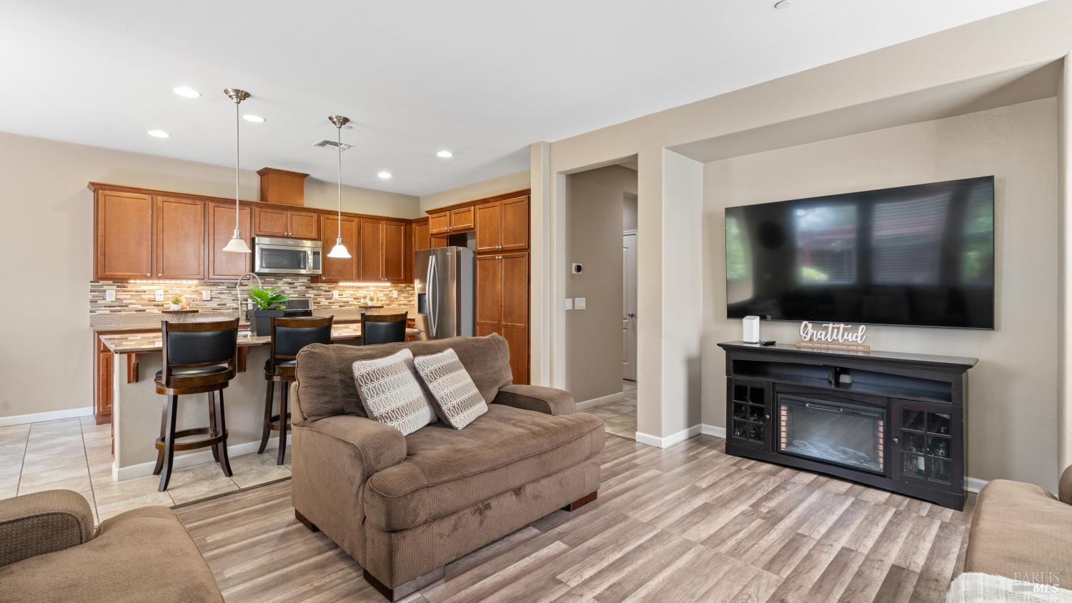 524 Chaparral Loop Vacaville, CA 95688 - Photo 10 of 43 a living room with furniture and a flat screen tv