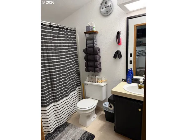 a bathroom with a toilet and a sink