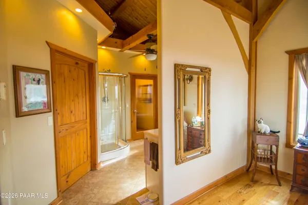 a bathroom with a sink mirror and a bathtub