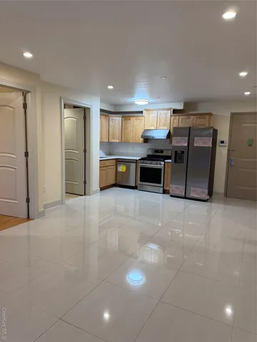 a kitchen with furniture and window