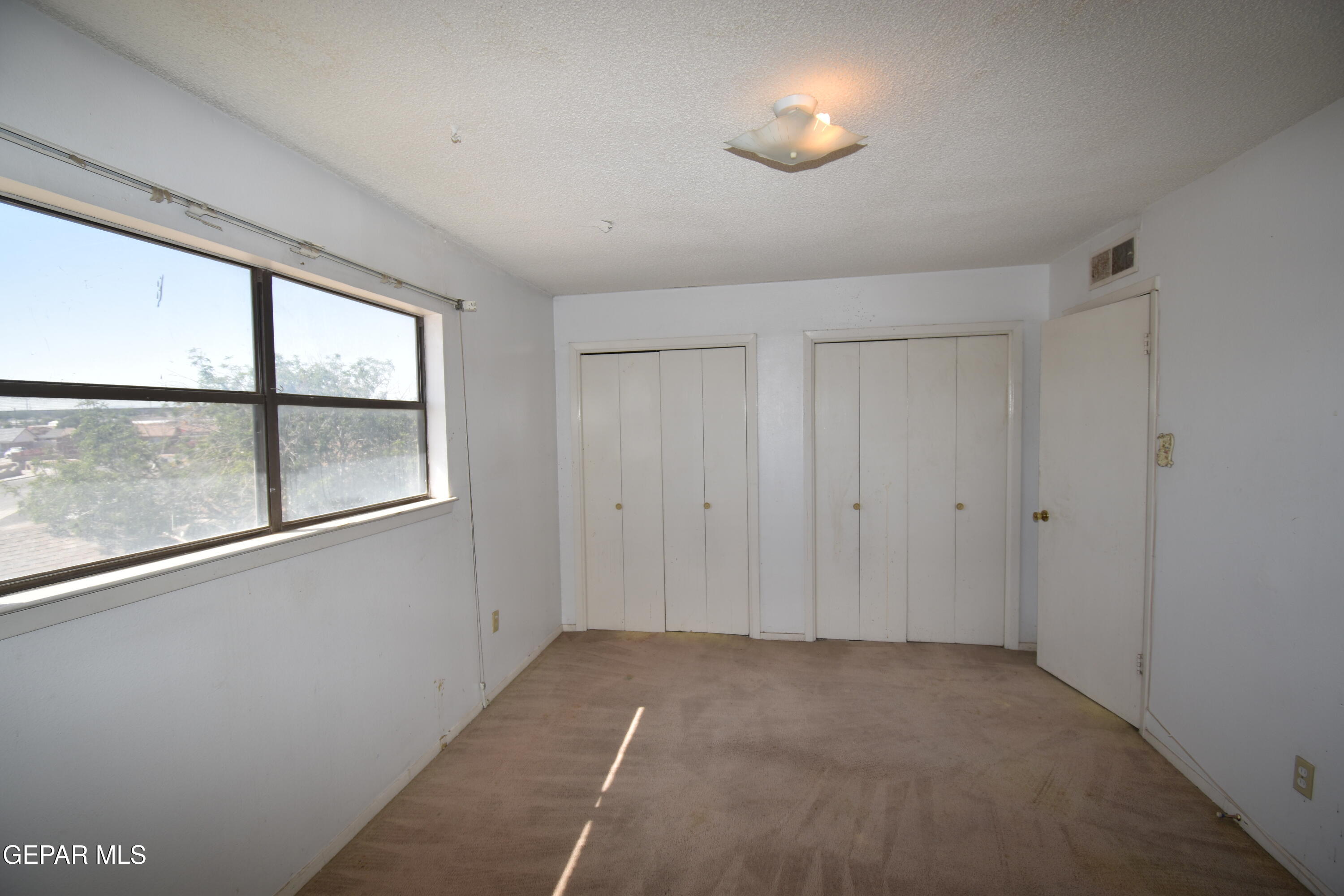 182 Prado Road El Paso, TX 79907 - Photo 14 of 19 a view of empty room with window