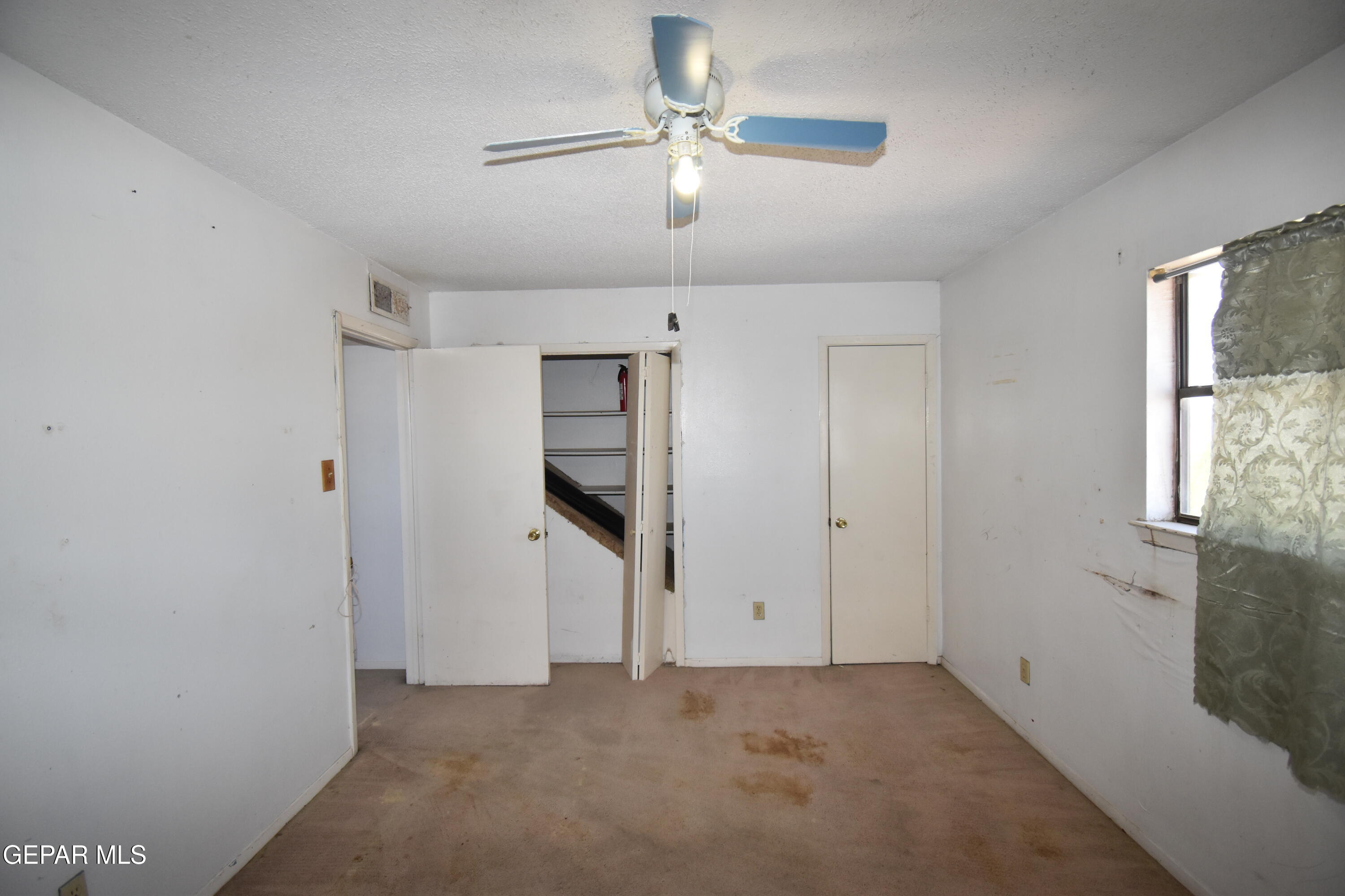 182 Prado Road El Paso, TX 79907 - Photo 16 of 19 a view of empty room with ceiling fan