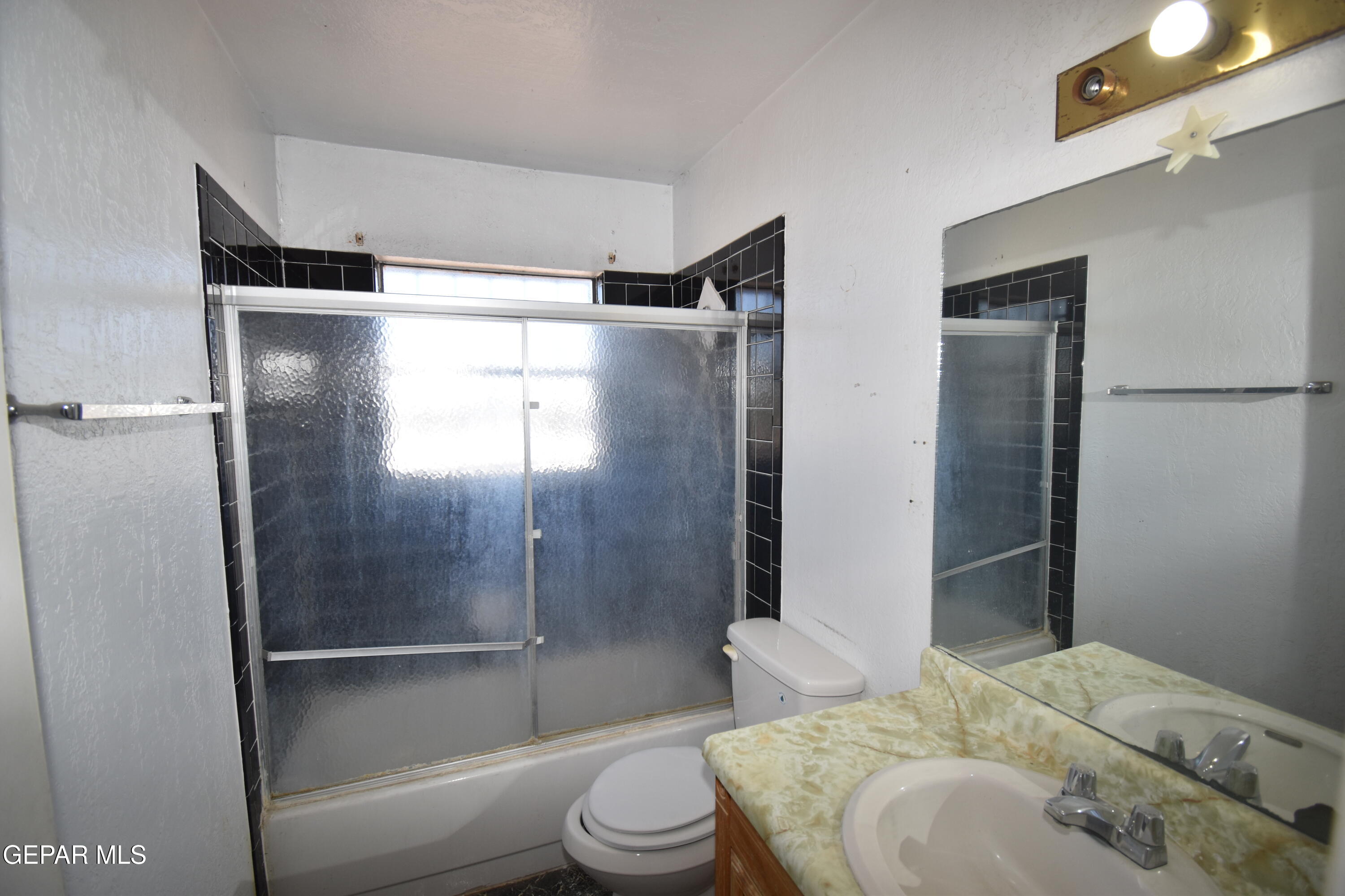 182 Prado Road El Paso, TX 79907 - Photo 17 of 19 a bathroom with a sink toilet and shower