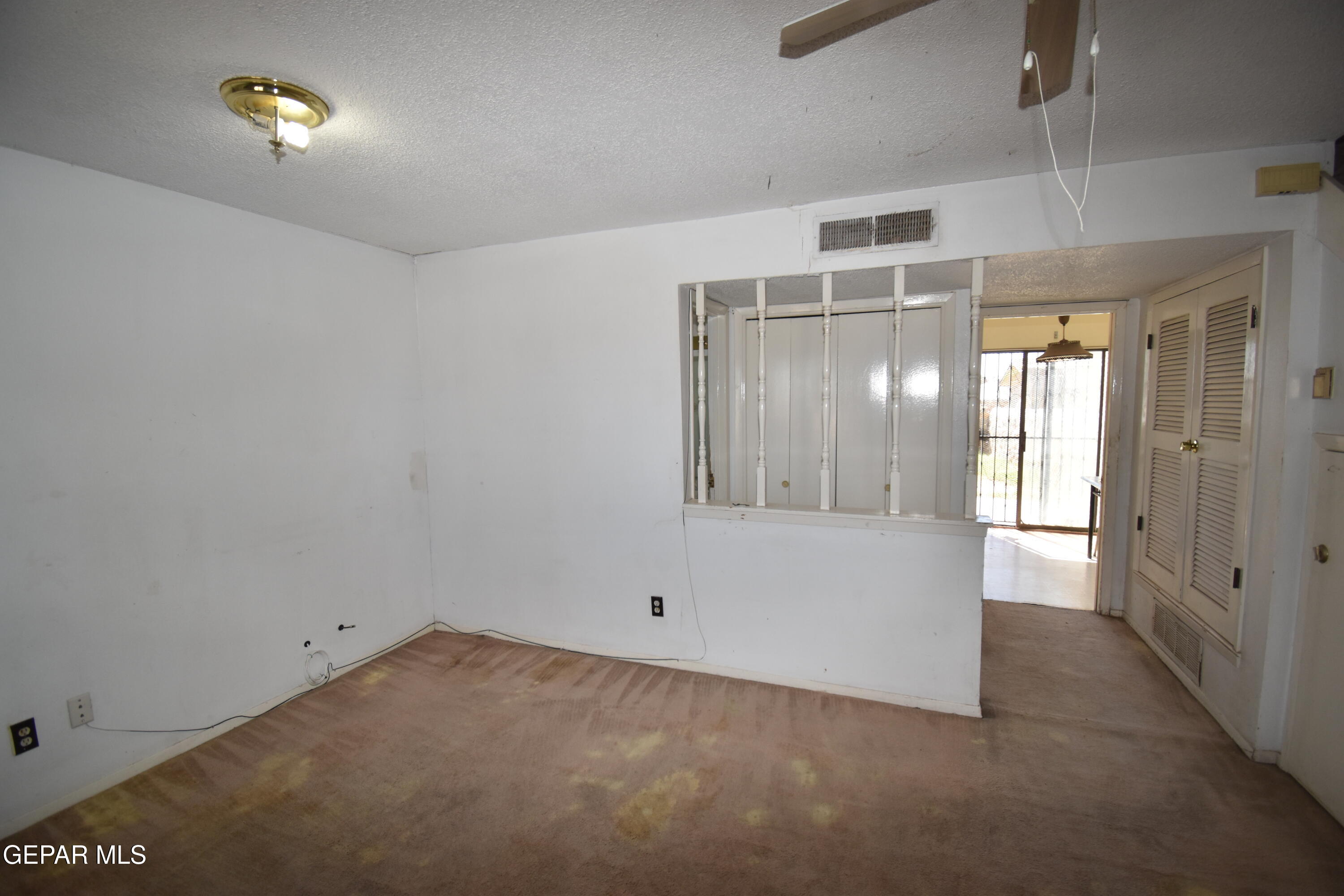 182 Prado Road El Paso, TX 79907 - Photo 4 of 19 a view of an empty room with a window