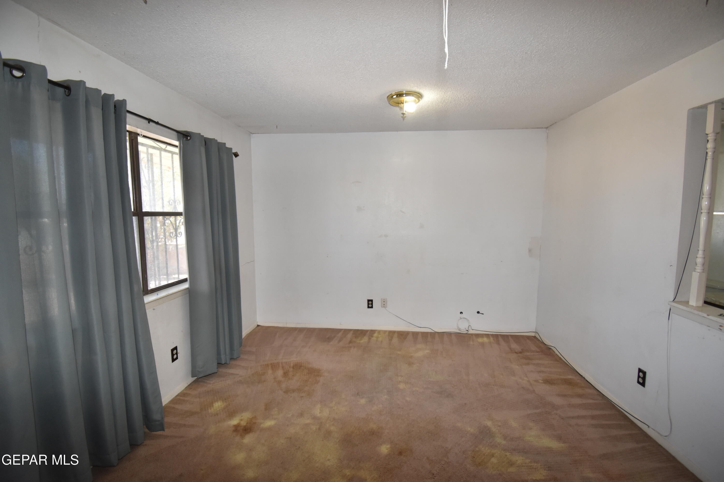 182 Prado Road El Paso, TX 79907 - Photo 7 of 19 a view of room with window and closet