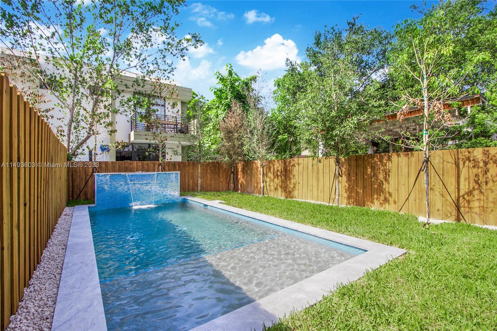 3242 Day Avenue Miami, FL 33133 - Photo 11 of 35 a view of a backyard with large trees