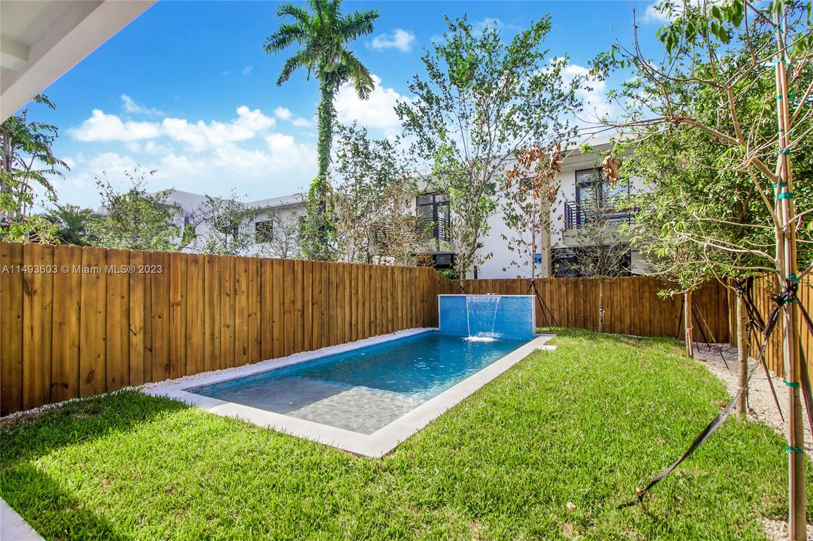 3242 Day Avenue Miami, FL 33133 - Photo 12 of 35 a view of a backyard with wooden fence