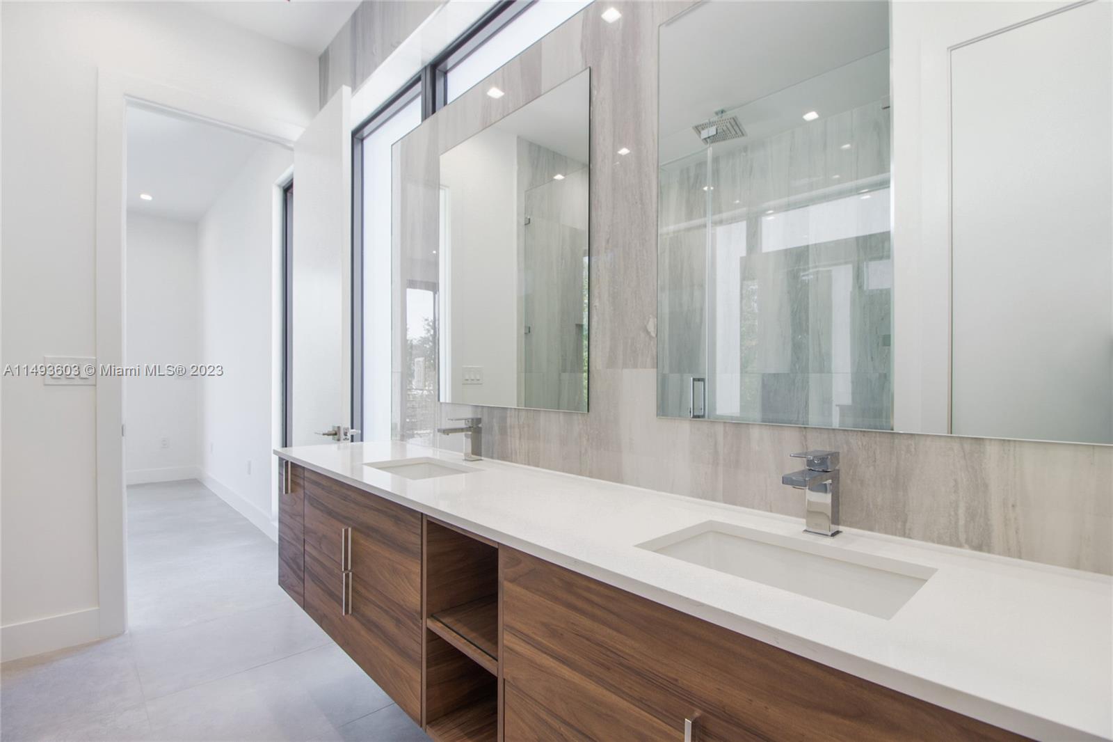3242 Day Avenue Miami, FL 33133 - Photo 20 of 35 a bathroom with a double vanity sink mirror and double