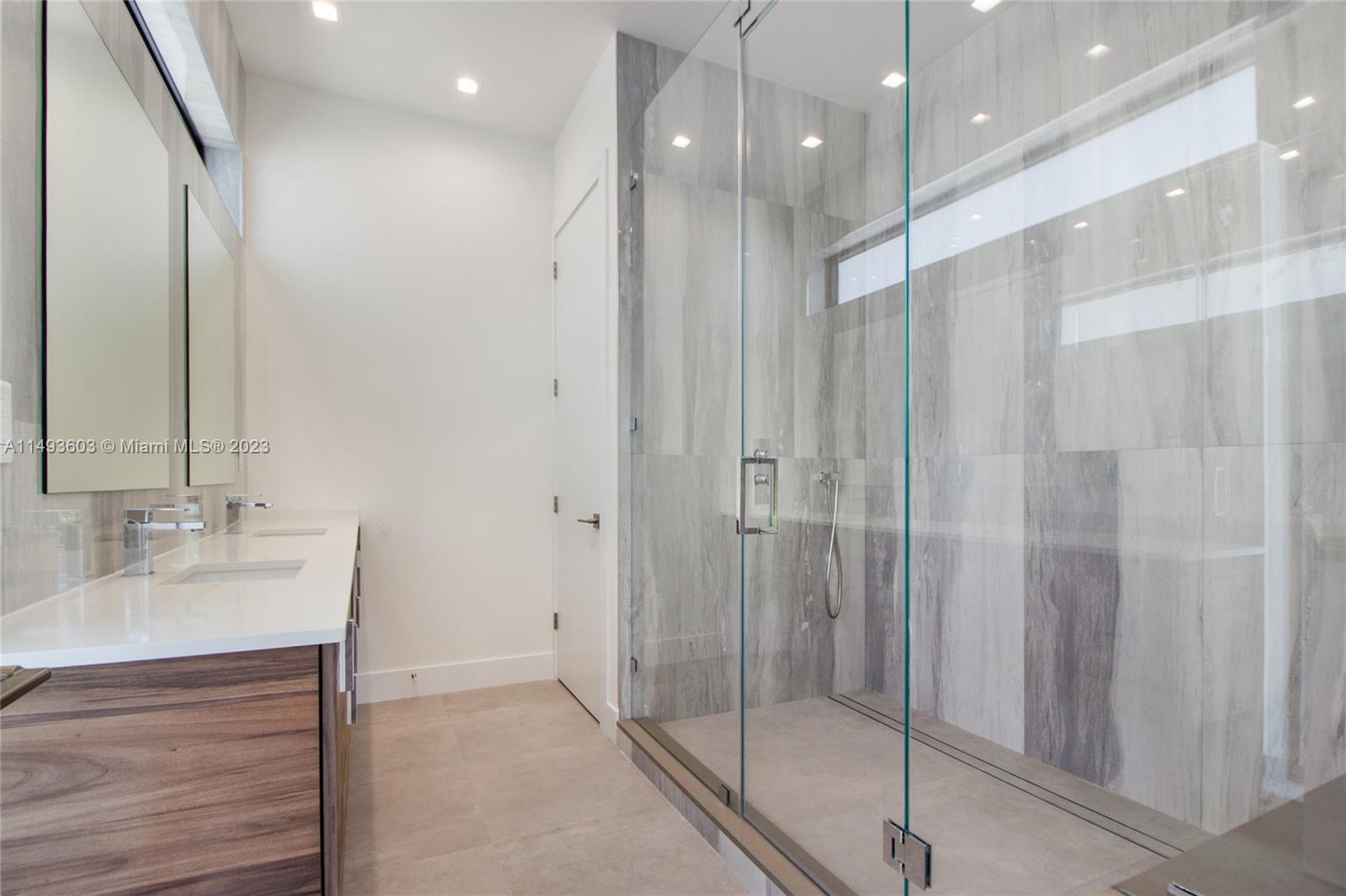 3242 Day Avenue Miami, FL 33133 - Photo 21 of 35 a bathroom with a shower and a sink