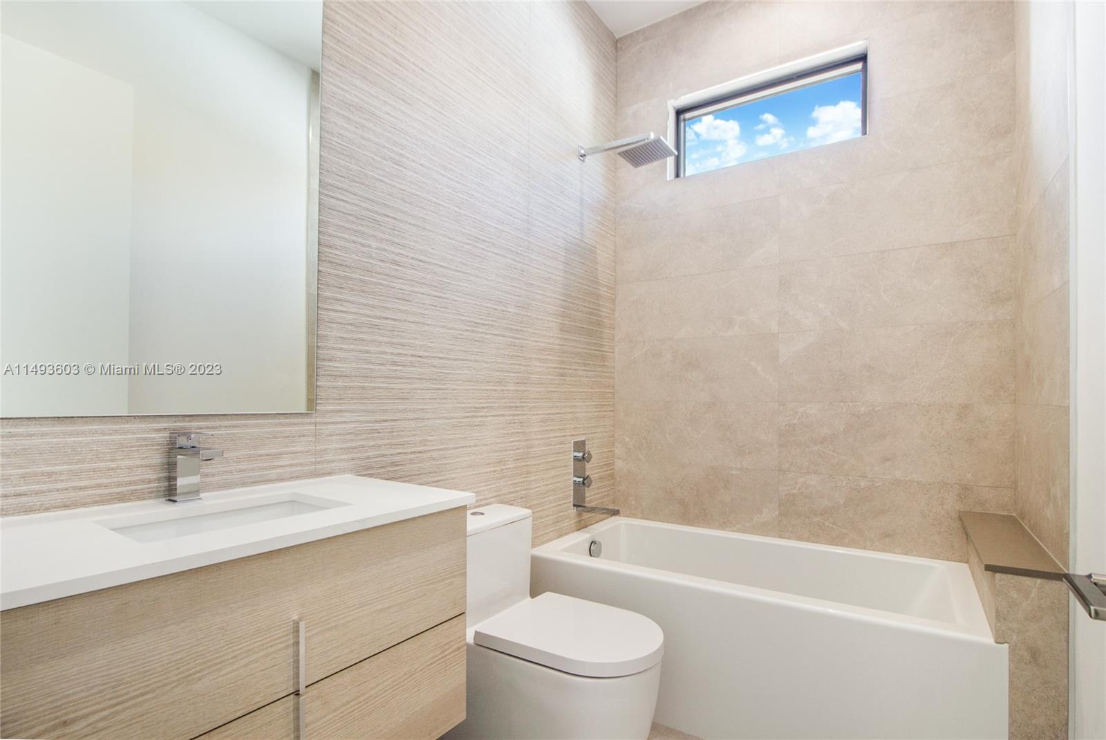 3242 Day Avenue Miami, FL 33133 - Photo 22 of 35 a bathroom with a sink a toilet and bathtub