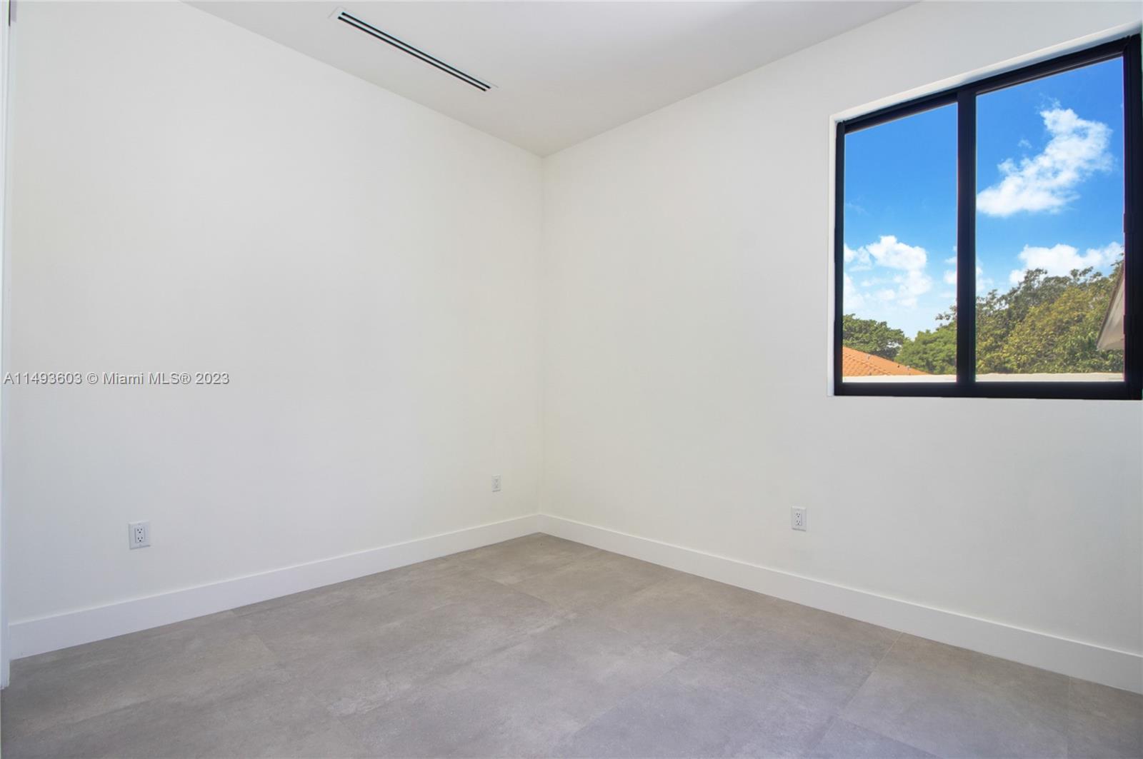 3242 Day Avenue Miami, FL 33133 - Photo 25 of 35 an empty room with a window