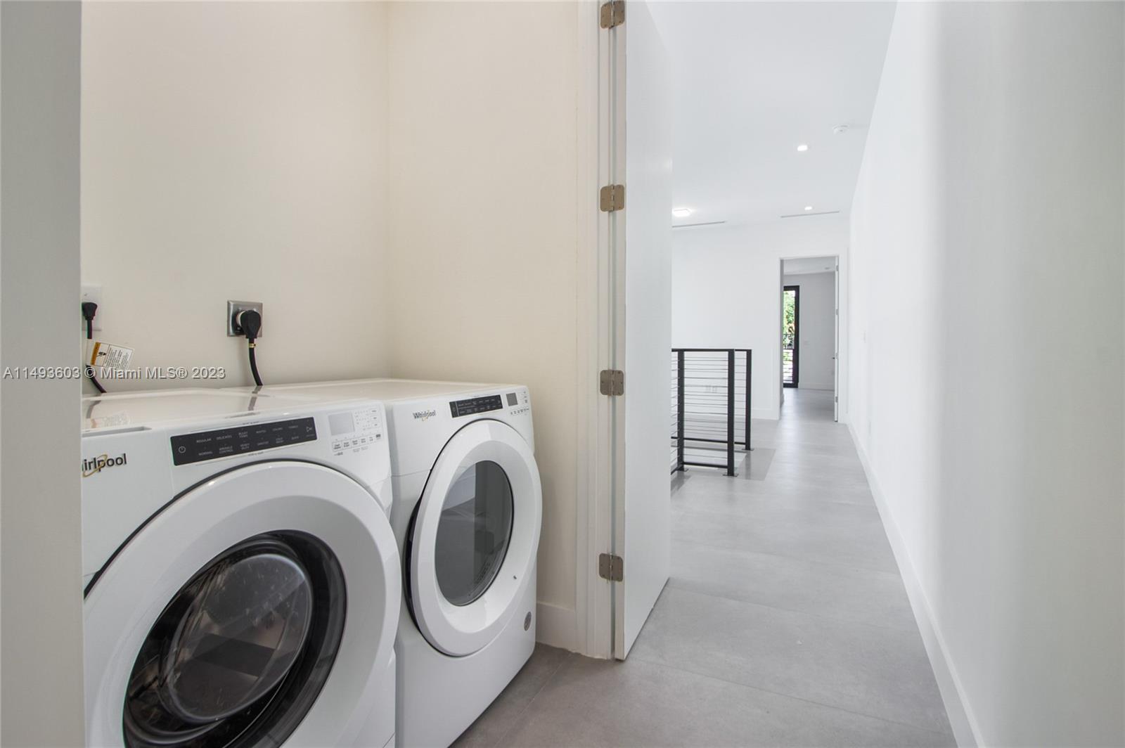 3242 Day Avenue Miami, FL 33133 - Photo 28 of 35 a view of a hallway with washer and dryer