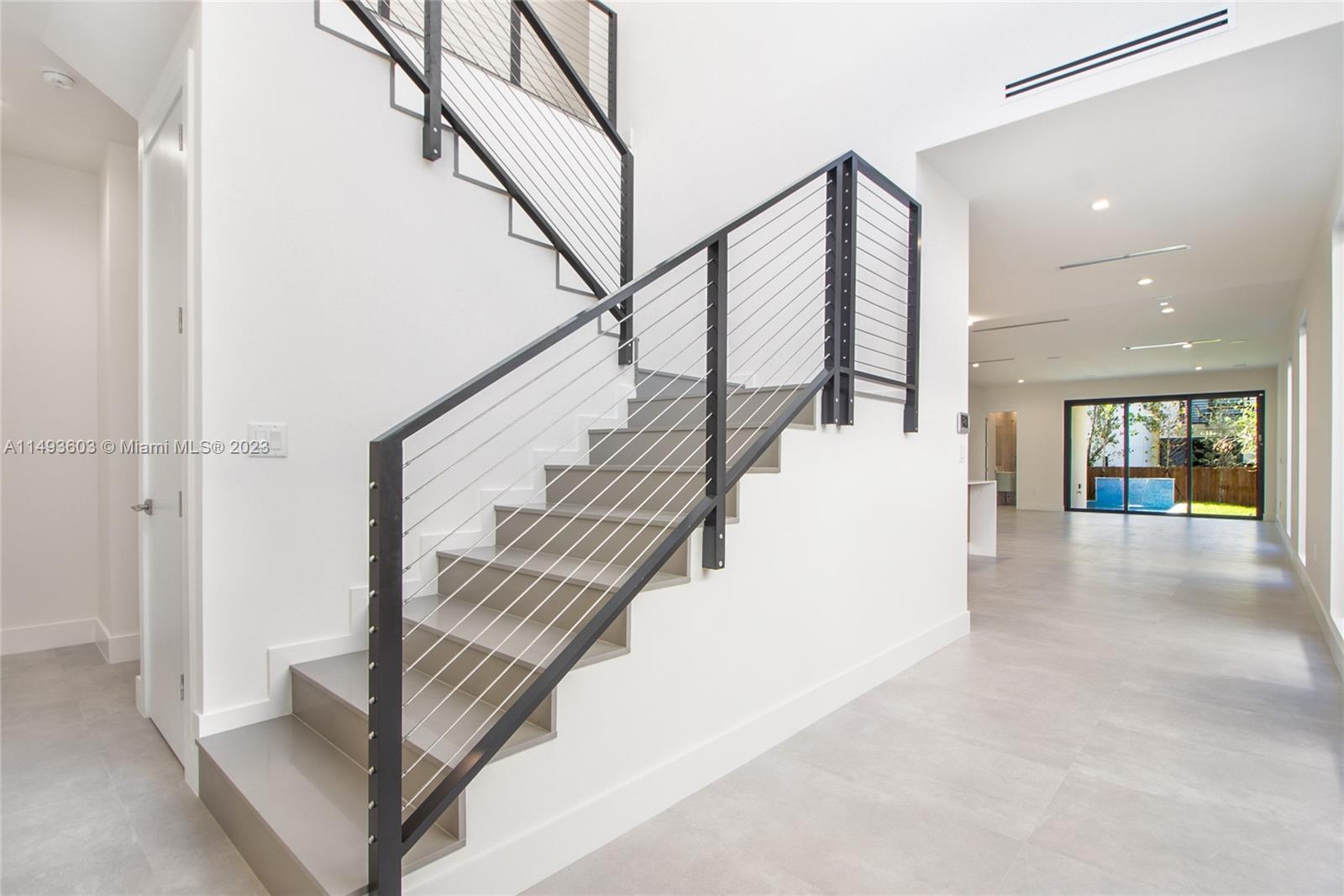 3242 Day Avenue Miami, FL 33133 - Photo 3 of 35 a view of entryway and hall with wooden floor