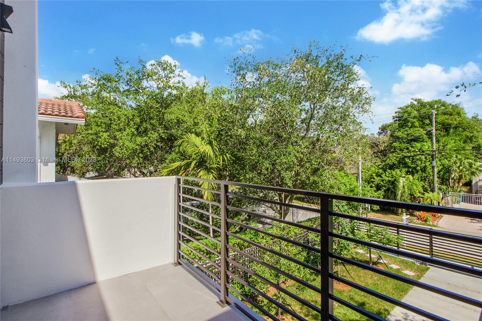 3242 Day Avenue Miami, FL 33133 - Photo 32 of 35 a view of a balcony with wooden fence