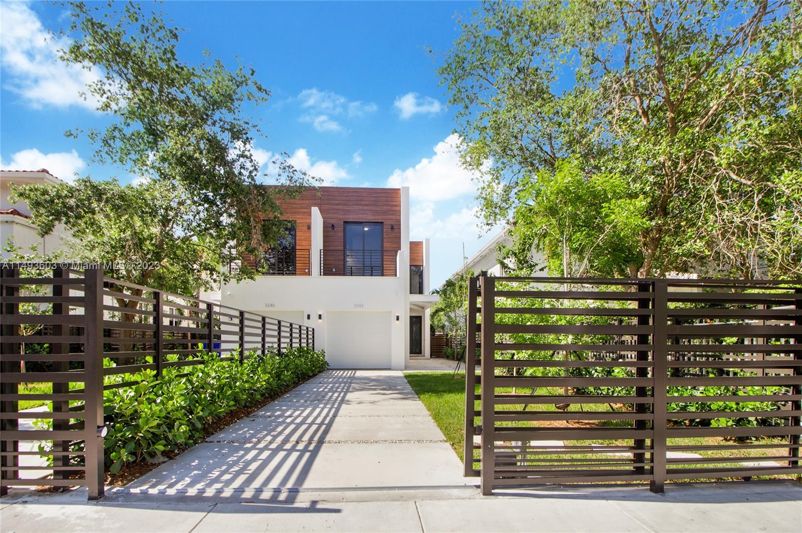 3242 Day Avenue Miami, FL 33133 - Photo 35 of 35 a front view of a house with a garden