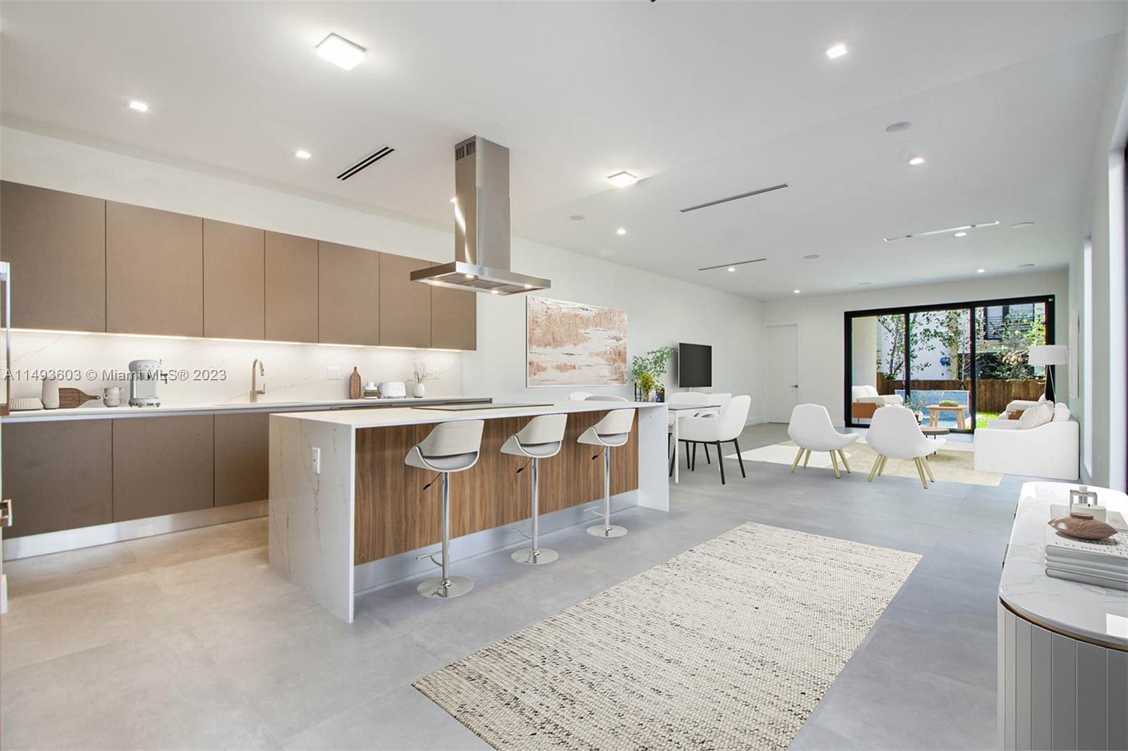 3242 Day Avenue Miami, FL 33133 - Photo 5 of 35 a kitchen with a sink dining table and chairs