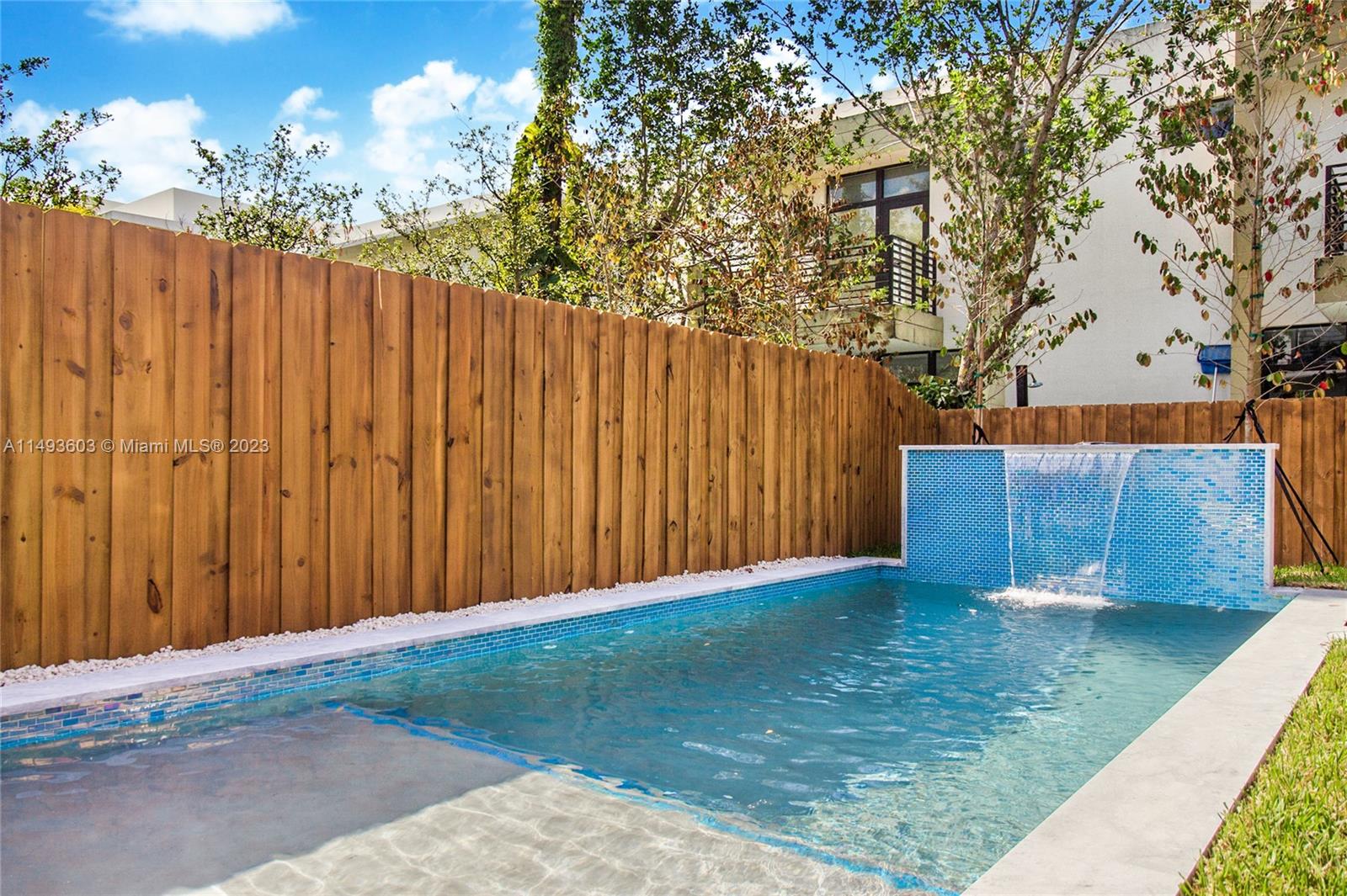 3242 Day Avenue Miami, FL 33133 - Photo 10 of 35 a view of backyard with wooden fence