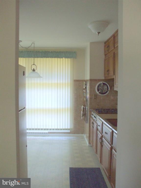 2738 Chapel Road Lancaster, PA 17603 - Photo 7 of 14 a bathroom with a granite countertop sink a mirror and a shower