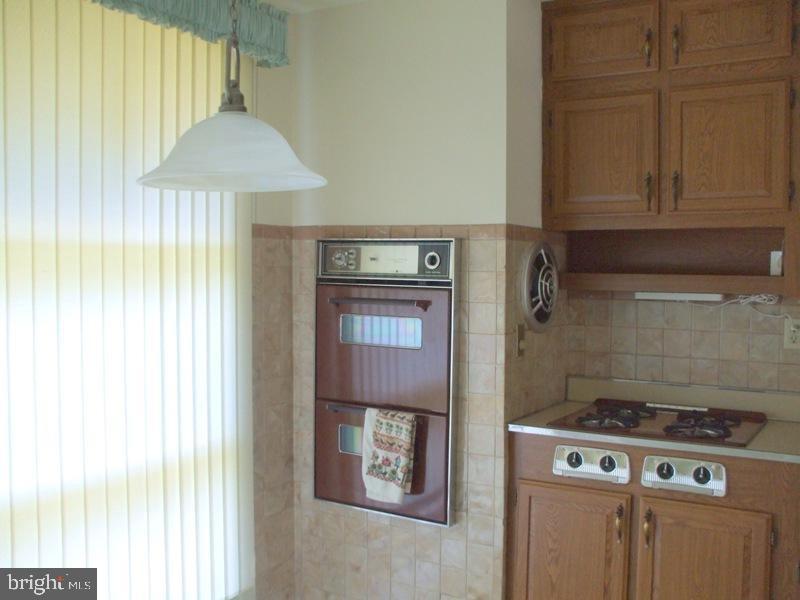 2738 Chapel Road Lancaster, PA 17603 - Photo 9 of 14 a kitchen with a stove and a refrigerator