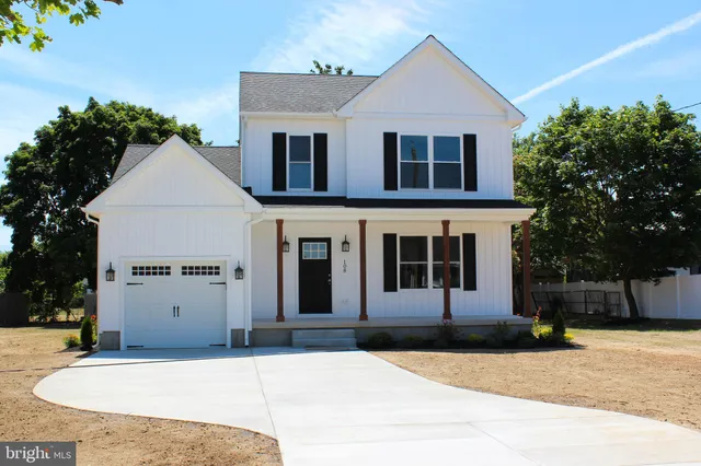 a front view of a house with garage