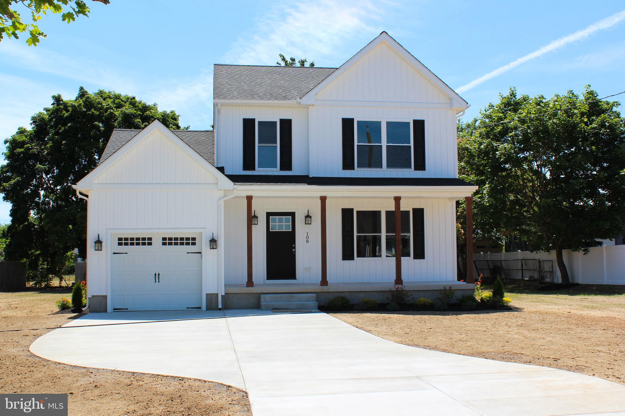 1402 Central Minotola, NJ 08341 - Photo 1 of 33 a front view of a house with garage