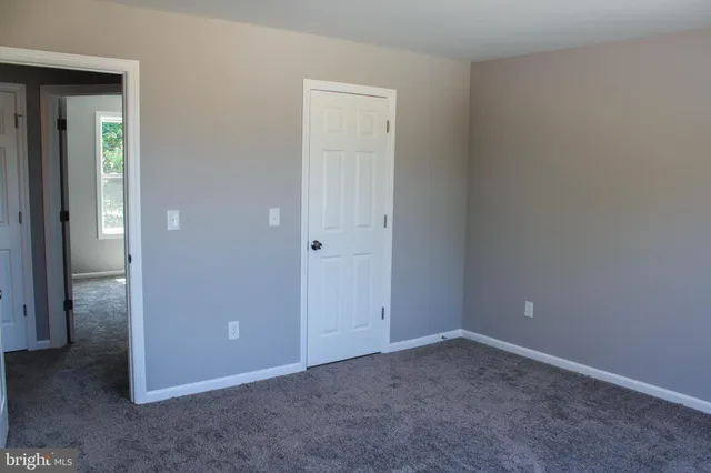 an empty room that has a window